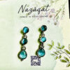 "Handcrafted teal gemstone drop earrings for women – silver-tone designer ethnic jewelry by Nazāqat, perfect for festive and daily wear." ✅ Keywords included: handcrafted earrings, gemstone drop earrings, ethnic jewelry, Nazāqat, women’s earrings.