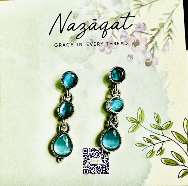 "Handcrafted teal gemstone drop earrings for women – silver-tone designer ethnic jewelry by Nazāqat, perfect for festive and daily wear." ✅ Keywords included: handcrafted earrings, gemstone drop earrings, ethnic jewelry, Nazāqat, women’s earrings.