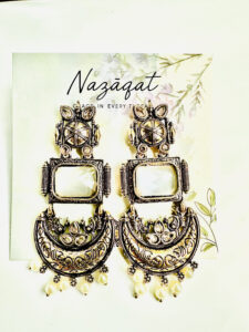 "Antique oxidized silver earrings with mirror centerpiece, lotus motifs, and pearl drops – Nazāqat handmade ethnic jewelry"