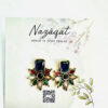 Multicolor floral stud earrings with rectangular blue stone in antique gold finish by Nazāqat