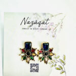 Multicolor floral stud earrings with rectangular blue stone in antique gold finish by Nazāqat