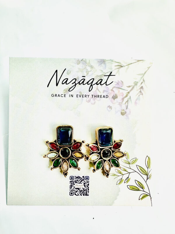 Multicolor floral stud earrings with rectangular blue stone in antique gold finish by Nazāqat