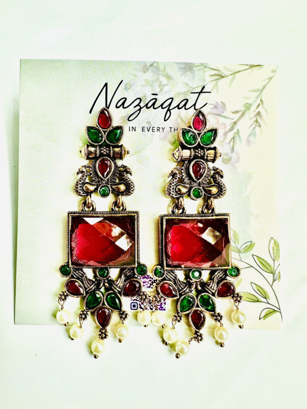"Red and green oxidized ethnic earrings with mirror centerpiece and pearl drops – festive traditional jewelry by Nazāqat"