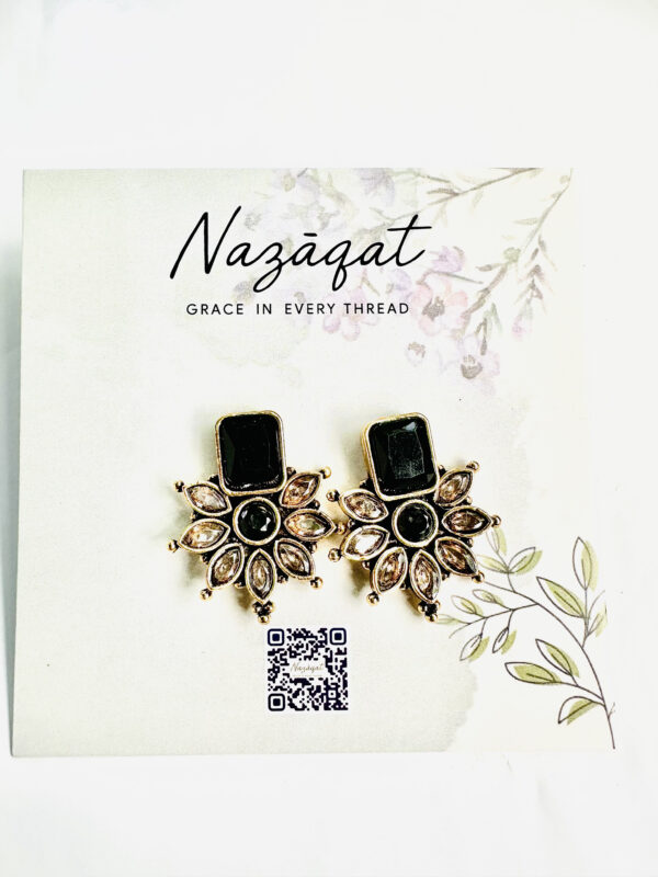 Black and gold floral stud earrings with antique finish and champagne petal stones by Nazāqat Jewelry