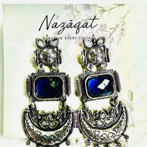 Handcrafted oxidized silver chandbali earrings with blue gemstone centerpiece and pearl detailing by Nazāqat