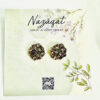 Floral oxidized silver earrings with antique gold and champagne mirror stones by Nazāqat, displayed on floral packaging card