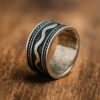 Oxidized silver unisex ring with wave pattern and textured antique finish